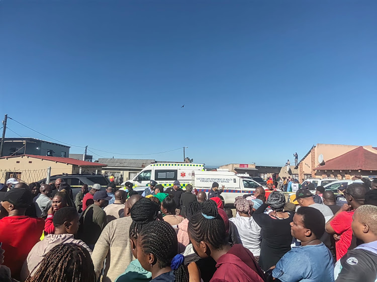 Onlookers and distraught parents converged on the scene of the death of a group of patrons at an East London tavern on Sunday morning.