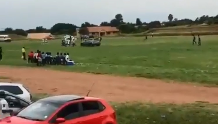 The unidentified driver of a BMW X5 drove into the pitch in high speed during a match as playing and coaching staff ran for cover.