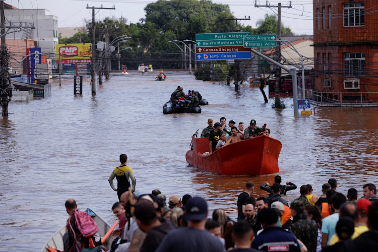 People are rescued after flooding in Canoas, at the Rio Grande do Sul state, Brazil, May 5 2024. Picture: Reuters/Amanda Perobelli