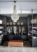 The all-black palette helps create a sense of calm and orderliness in the dressing room.