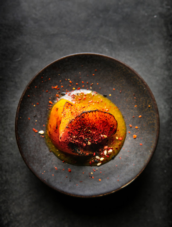 Binchotan grilled persimmon with shichimi.