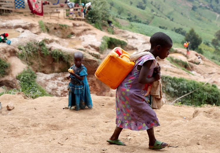 A girl carries a container of water in Kamatare, North Kivu, the Democratic Republic of Congo, December 1 2018. Picture: REUTERS/Goran Tomasevic