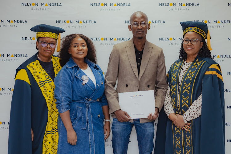 Nelson Mandela University’s executive dean of the faculty of humanities, Prof Pamela Maseko, left, Mninawe Jim, Nontlahla Siwisa and deputy vice-chancellor: learning and teaching Dr Muki Moeng after the graduation ceremony at which Mziwenene Tinzi was posthumously conferred a Bachelor of Arts degree