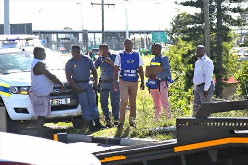 Beacon Bay Police at the scene, near Nompumelelo, where the body of a woman was found yesterday morning Picture: MARK ANDREWS © DAILY DISPATCH