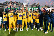 Bjorn Fortuin lifts the T20 Challenge trophy, the Lions' second title of the 2023/24 season.