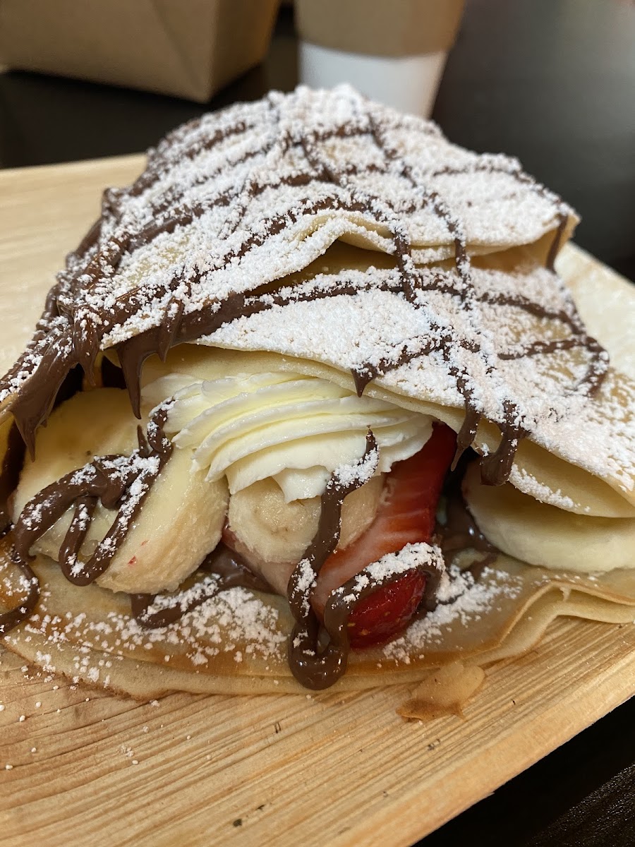 Strawberries and cream crepe and my daughter added nutella and banana
