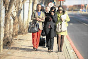 IN TEARS: Zenani Mandela, right,  with her niece Zoleka  outside the Johannesburg Magistrate's Court yesterday.  PHOTO: MABUTI KALI