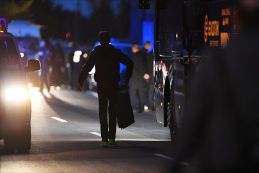 The team bus of Borussia Dortmund with some windows broken by an explosion some 10km away from the stadium prior to the UEFA Champions League 1st leg quarter-final football match BVB Borussia Dortmund v Monaco in Dortmund, western Germany on April 11, 2017.