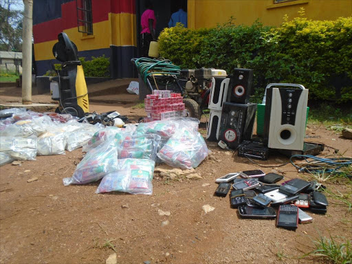 Sachets of illicit alcohol, mobile phones and other items that were found following the arrest of 14 youths in Bungoma town, May 5, 2016. Photo/BRIAN OJAMAA