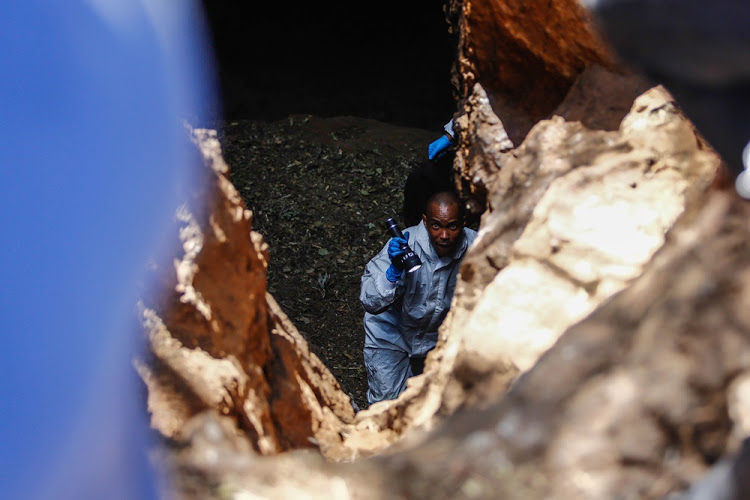 Police investigate the gruesome discovery of badly decomposed bodies in a cave at a smallholding in Hennops River Valley on May 22 2018. Image: Moeletsi Mabe