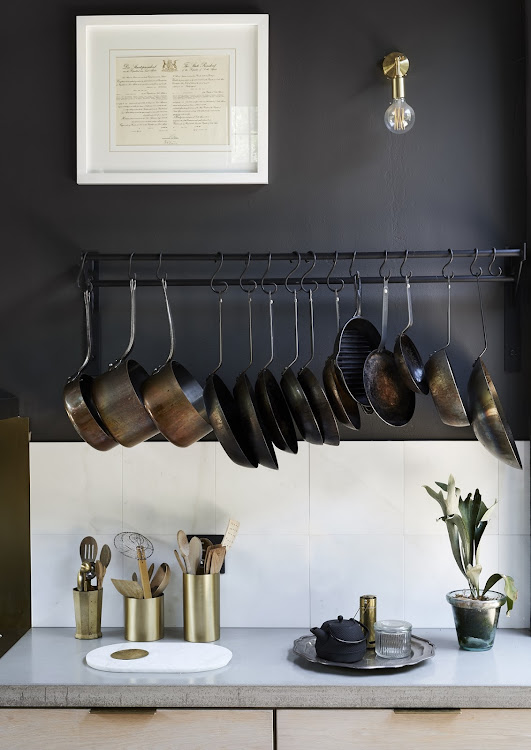 The details in the kitchen are an example of what the homeowners refer to as functional design that makes aspects of ordinary life – like preparing meals and tending to plants – a joy and a pleasure.