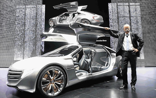 Daimler chief executive Dieter Zetsche poses with the fuel cell show car F125