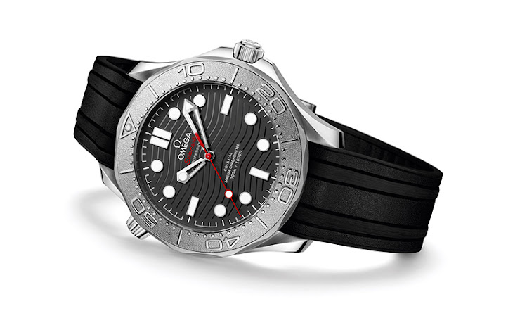 The Omega Seamaster Diver 300M Nekton Edition is powered by the Master Chronometer Calibre 8806. It features a laser ablated black ceramic dial with wave relief and a unidirectional rotating bezel in Grade 5 titanium with laser-ablated diving scale in positive relief. The watch is also certified to resist magnetic fields of 15,000 gauss.