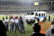 Violence erupted at the Moses Mabhida Stadium in Durban as angry Kaizer Chiefs fans stormed the pitch and attacked Premier Soccer League security personnel and destroyed after property after Steve Komphela's side bombed out of the Nedbank Cup following a 2-0 defeat at the hands of Free State Stars on Saturday April 21 2018.
