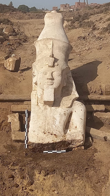 A section of a limestone statue of Ramses II unearthed by an Egyptian-US archaeological mission in El Ashmunein.