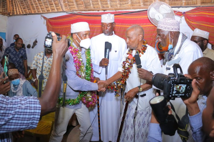 Garissa Governor Ali Korane is being congratulated by the Awdhaq council of elders Sultan Dekhow Sambul after he was endorsed as the sole candidate for the Garissa governorship in 2022 election.