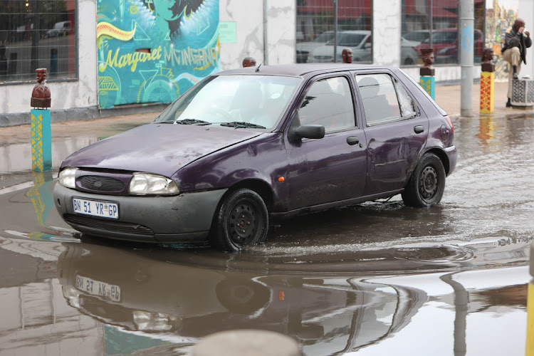 A car makes its way through a flooded road in Newtown, Johannesburg. File image