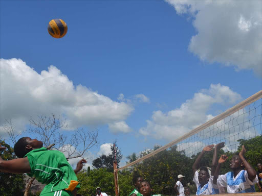 A player spikes a ball during past inter counties games. /FILE