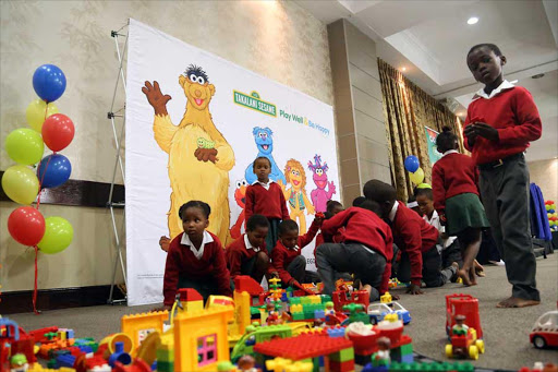 BUILDING BLOCKS FUN: Grade R children from Shed Mashologu Primary in Mdantsane play with Lego bricks during the Play and Be Happy educational intervention launch yesterday Picture: SIBONGILE NGALWA