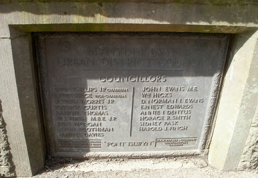 The Mynyddislwyn Urban District Council plaque is embedded in masonry on the west side of Pont Islwyn Link across the River Sirhowy. It records the opening of the bridge in 1928. © Copyright...