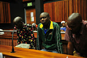 October 24, 2016. Zimbabwean nationals  Thabo   Nkala , Edmor Ndlovu and Mduduzi Mathibela appear in the high court sitting in the Palm Ridge Magistrate’s Court to answer for the murder of Zukisa Kela and Sizwe Tyele, who were drowned at Rhodes Park last year. Pic: Veli Nhlapo. © Sowetan