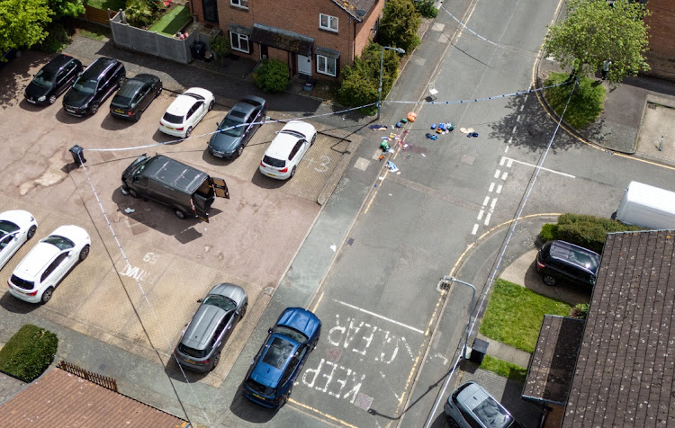 An aerial view as Police officers work at the scene after a sword attack on April 30, 2024 in Hainault, England.