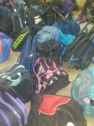 School bags in the hall at the Hoerskool Driehoek bear witness to a school day that changed dramatically when a walkway collapsed on Friday. Three pupils were killed and 15 were injured.
