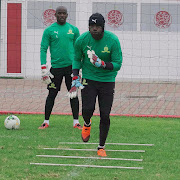 Mamelodi Sundowns goalkeepers Denis Onyango (wearing a headgear) and Kennedy Mweene go through their paces in Casablanca ahead of the Caf Champions League group match against defending champions Wydad Casablanca of Morocce. 