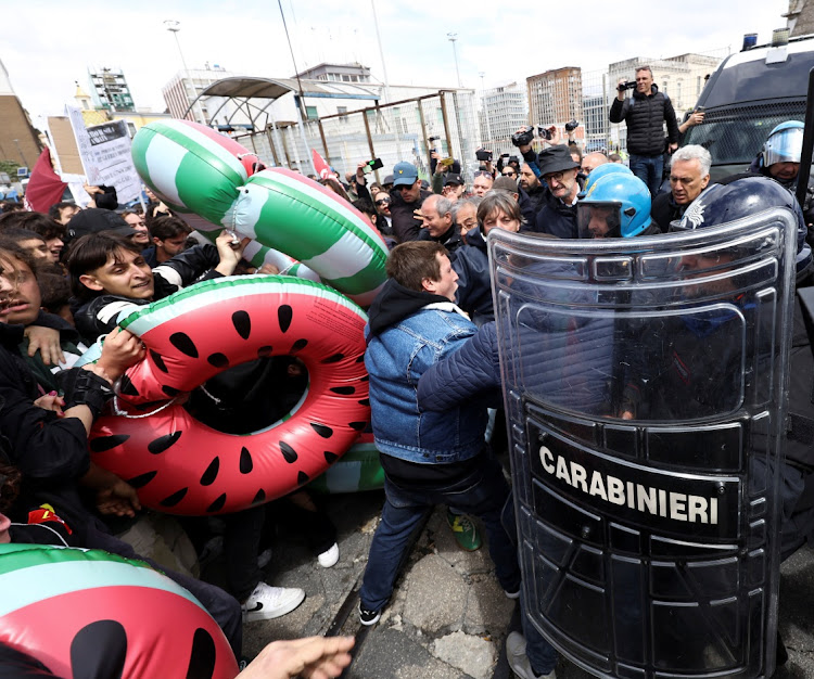 Pro-Palestinian activists clash with police, as they try to embark on a ferry to protest G7 meeting on Capri Island, at a port in Naples, Italy, April 19, 2024.