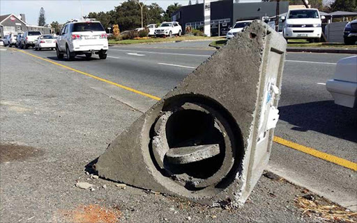 TRASHED: Residents have complained about Buffalo City’s concrete, triangle-shaped bins, many of which are damaged or have toppled over, like this one in Old Transkei Road Picture: BARBARA HOLLANDS