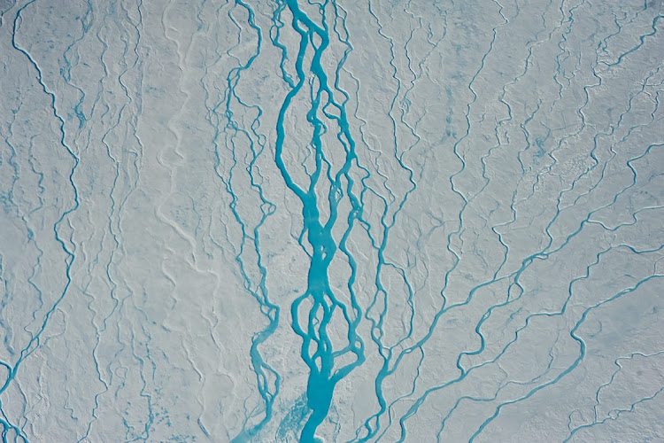 Rivers of meltwater in the ablation zone of Greenland's ice sheet.