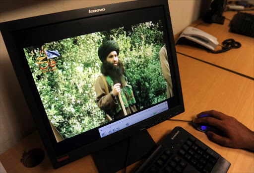 In this photograph taken on July 23, 2010, a Pakistani journalist watches a newly released video of radical Pakistani cleric Maulana Fazlullah in Peshawar. The Pakistani Taliban on November 7, 2013, have elected Maulana Fazlullah as their new chief following the death of the previous leader in a US drone strike.