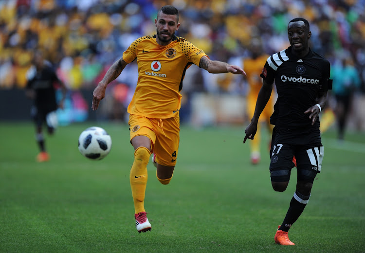 Daniel Cardoso of Kaizer Chiefs in action with Justin Shonga of Orlando Pirates during the Absa Premiership match between Orlando Pirates and Kaizer Chiefs at FNB Stadium on March 03, 2018 in Johannesburg, South Africa.