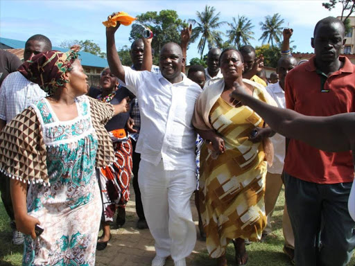 Nyali MP Hezron Awiti (in white) with mnazi vendors at Frere Town during a past event in Mombasa. /BRIAN OTIENO
