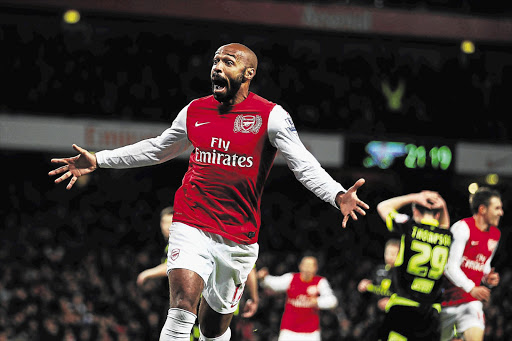 Thierry Henry, pictured here in file photo during his time with Arsenal, could be re-united with Gunners as soon as his playing days with MLS outfit New York Red Bulls comes to an end.