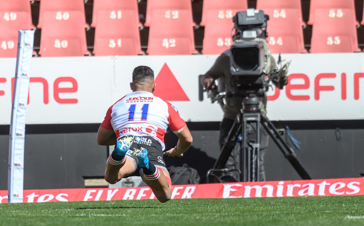 Stean Pienaar of the Xerox Golden Lions crashes over the try line.