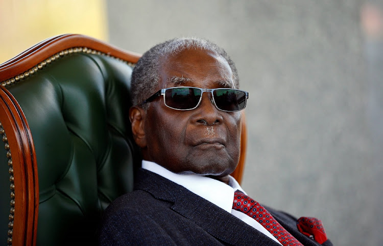 Zimbabwe's former president Robert Mugabe looks on during a press conference at his private residence nicknamed "Blue Roof" in Harare, Zimbabwe, July 29, 2018.