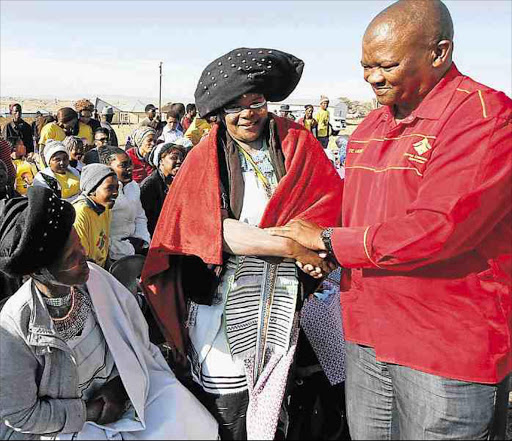 SORRY: UDM president Bantu Holomisa greets supporters on his arrival at Mpheko, Mthatha to hand over an ox to chiefs after he was fined in 2014 for being late Picture: LULAMILE FENI