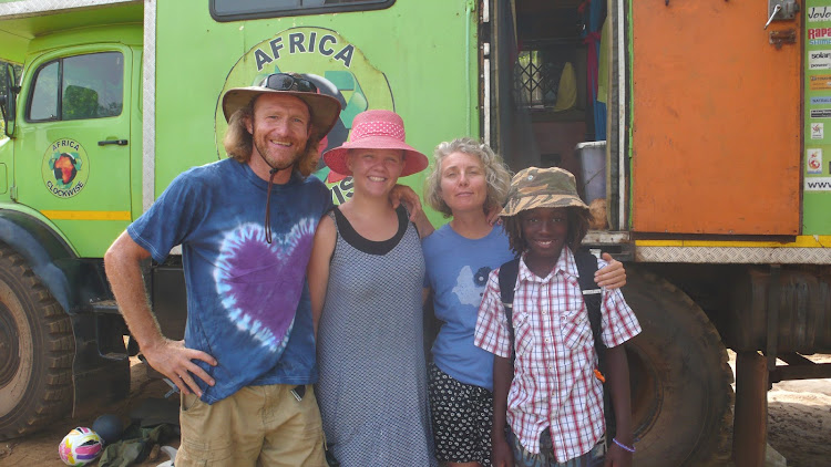 The Sampson family next to their "Big Green Truck" in 2015, somewhere outside of Cairo.