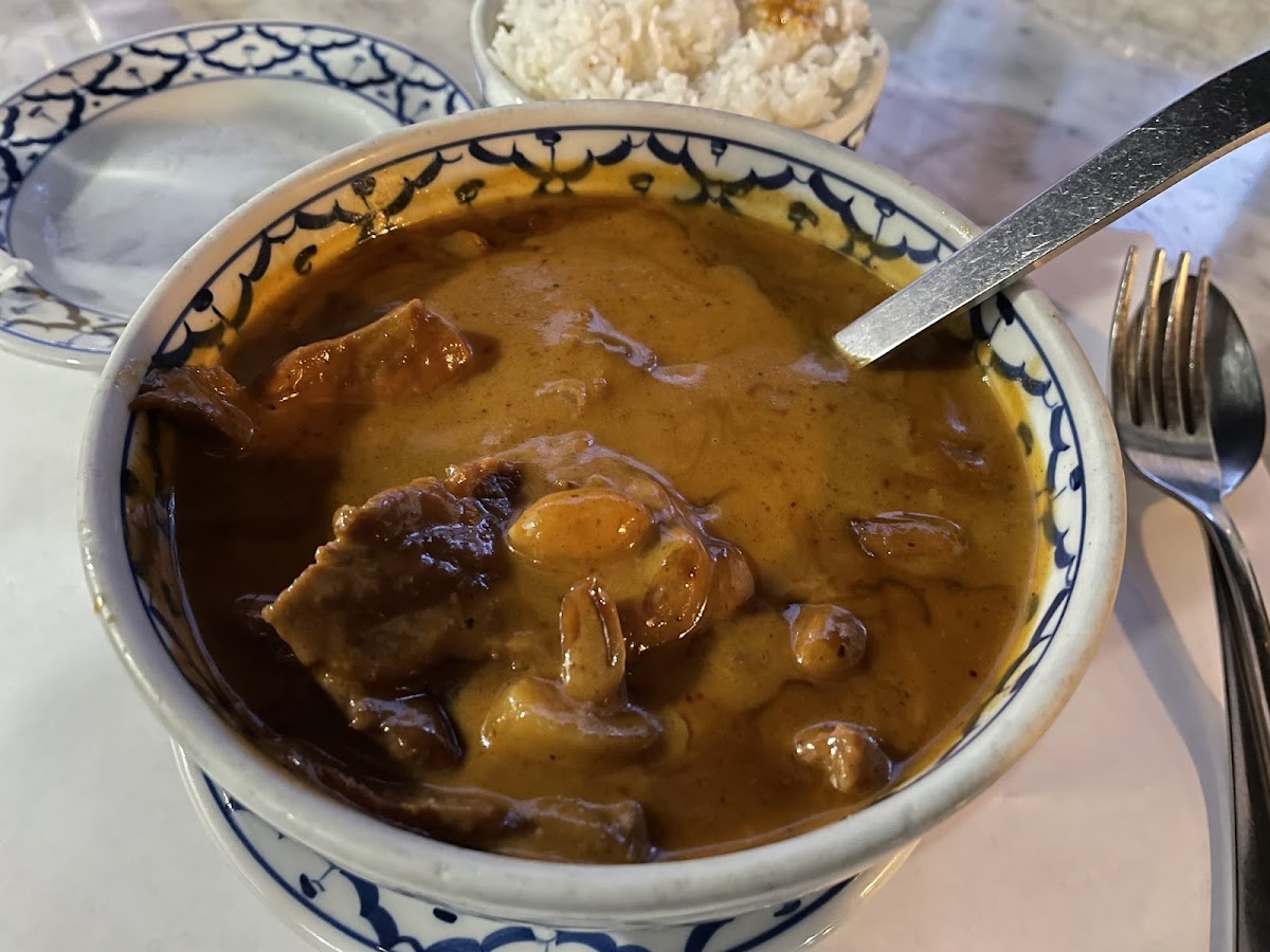 Bowl of Matsaman curry. beef and potato w/ sticky white rice