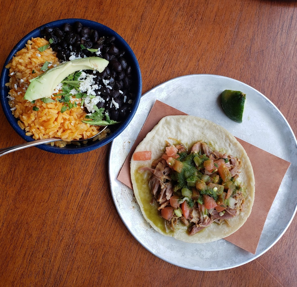 Carnitas taco & side of rice and beans