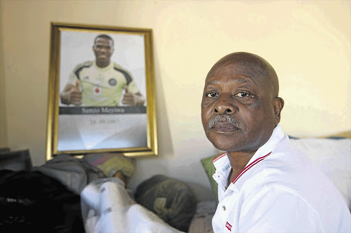 Sam Meyiwa, father of the Bafana Bafana star, in his son's room.