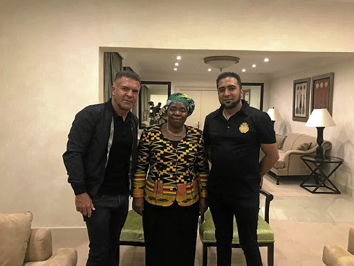 Nkosazana Dlamini-Zuma flanked by Adriano Mazzotti, left, and Carnilinx COO Mohammadh Sayed. Mazzotti has distanced himself from the minister, saying he had simply requested a photo.