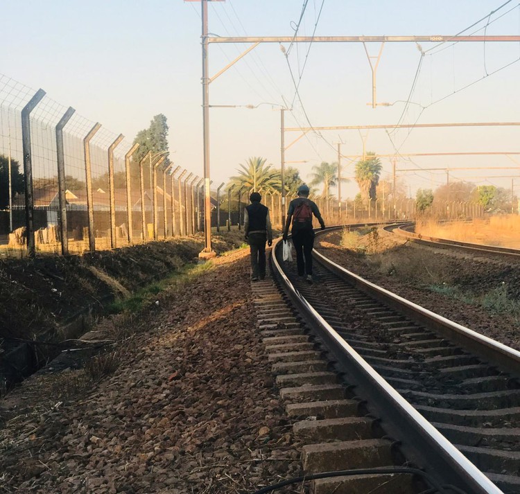 The coal hunters climb on to goods trains to steal coal which they use at home and sell to buy food for their families.