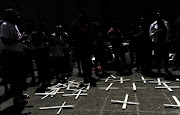 Families, relatives and community members gather for a prayer vigil in remembrance of 37 psychiatric patients on October 27, 2016 in Johannesburg, South Africa. File photo. Christine Nxumalo, the sister of one of the patients who died, has accused Qedani Mahlangu of cowardice after the health MEC resigned, saying 