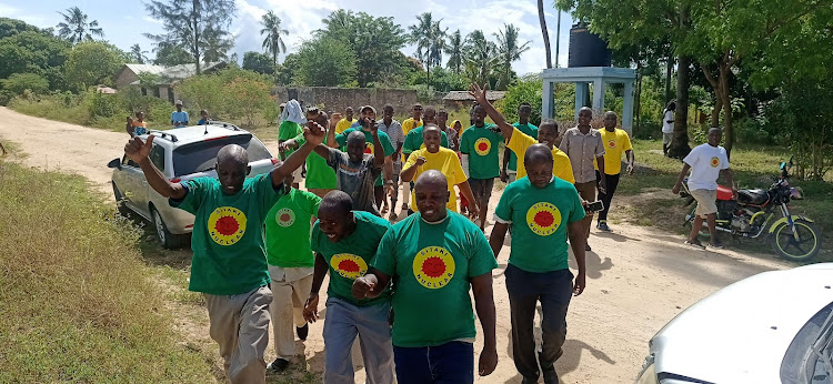 Environmental activists and Chumani residents outside the Chumani social hall in Kilifi county on Wednesday.