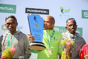 Mens winners (L-R) Warinyane Lebopo, Lungile Gongqa and Teboho Sello during the 2017 Old Mutual Two Oceans Marathon 56km awards ceremony on April 15, 2017 in Cape Town,