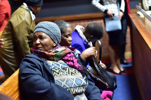 Family members of Rachel Dolly Tshabalala seen during murder trial of Donald Sebolai in the South Gauteng High CourtGÇÜ sitting at the Palm Ridge Magistrate's Court on July 27, 2015 in Palm Ridge, South Africa. The former Jozi FM DJ is standing trial on charges of murder for stabbing his girlfriend, Rachel "Dolly" Tshabalala, after they had a fight at his Soweto flat in June last year.