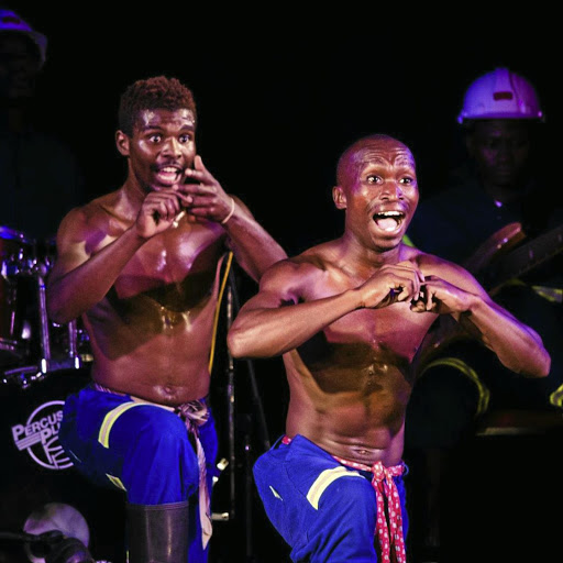 Members of 'Stimela The Gumboot Musical' in full cry on stage in Australia during their tour.