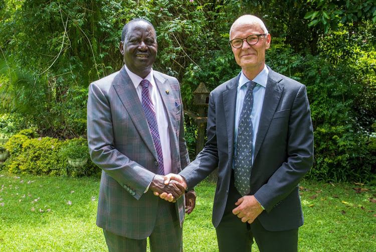 Azimio leader Raila Odinga greeting Norwegian ambassador to Kenya Gunnar Andreas Holm in Nairobi on April 25, 2024.